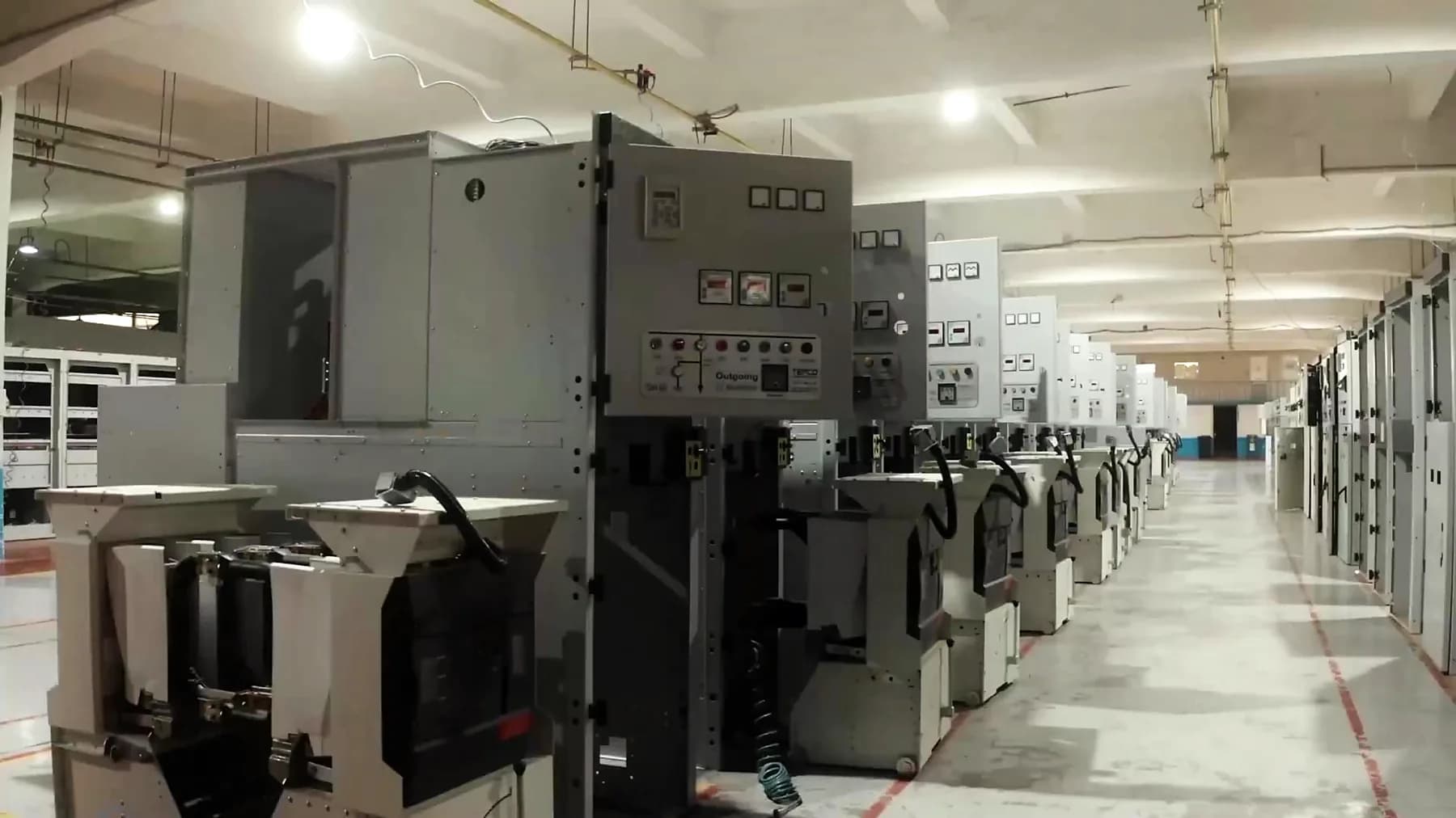 A line of medium voltage panels with test equipment alongside