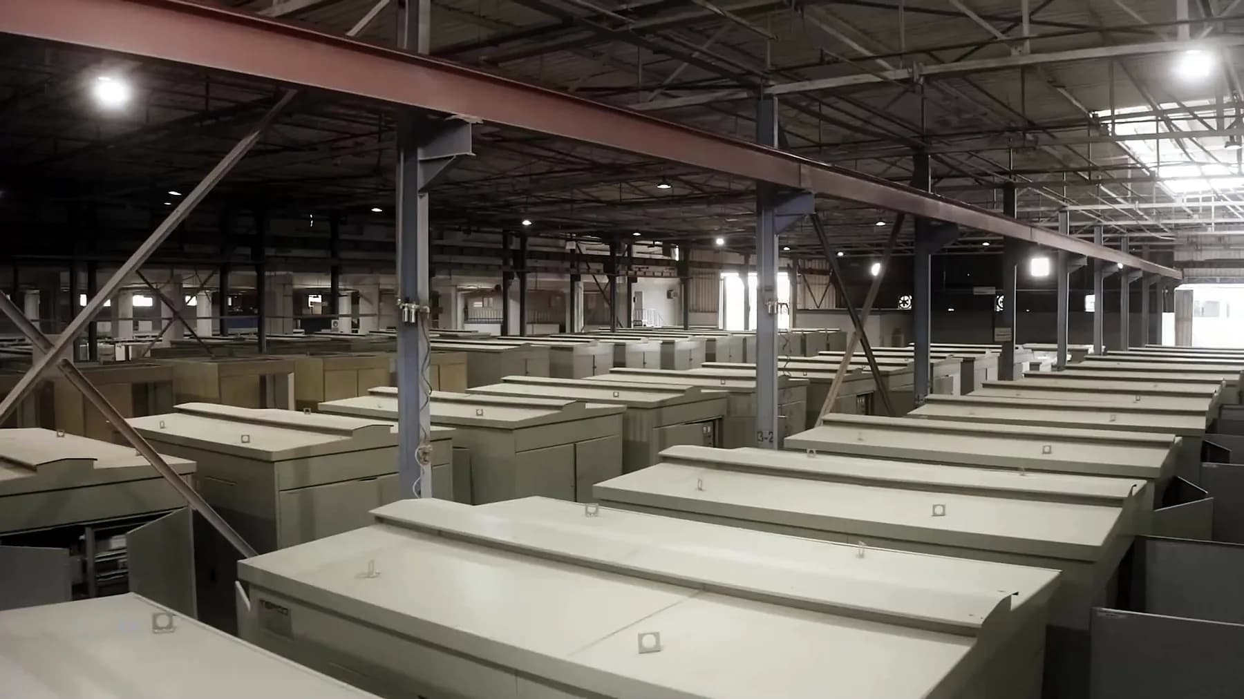 Rows of finished cubicles seen from above in the group's manufacturing hall