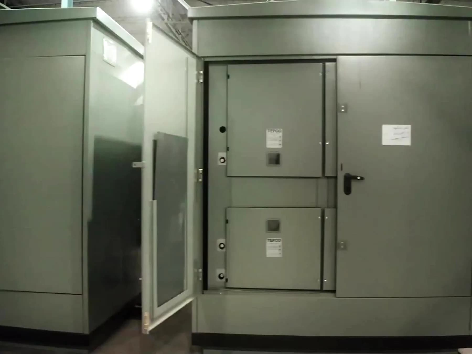 Package substation enclosures standing outside the hall